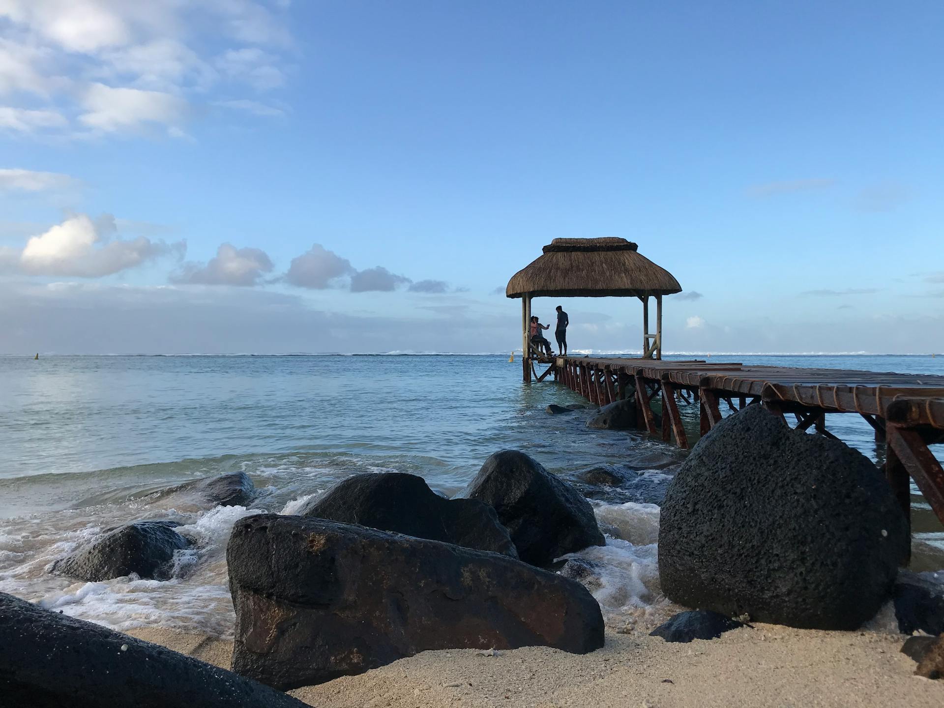 Relax at a tropical beach gazebo with stunning ocean views in Bel Ombre.