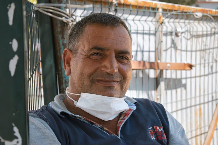 Portrait Of A Man With A White Facemask