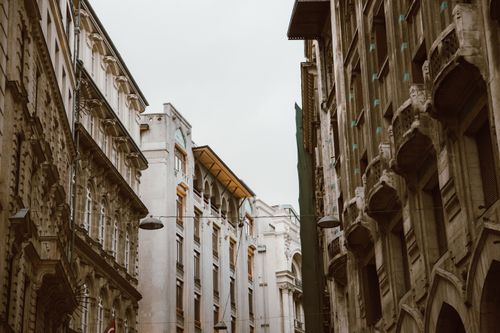 Free Low angle view of historic European architecture buildings with intricate facades. Stock Photo