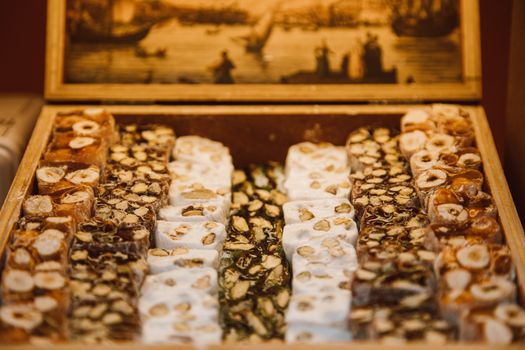 Assorted Flavors of Sweets with Nuts in a Wooden Box