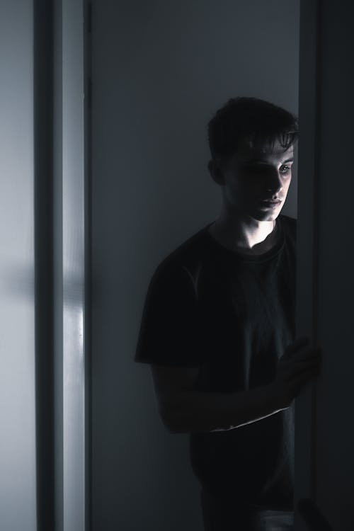 A Boy Peeking in a Dark Room