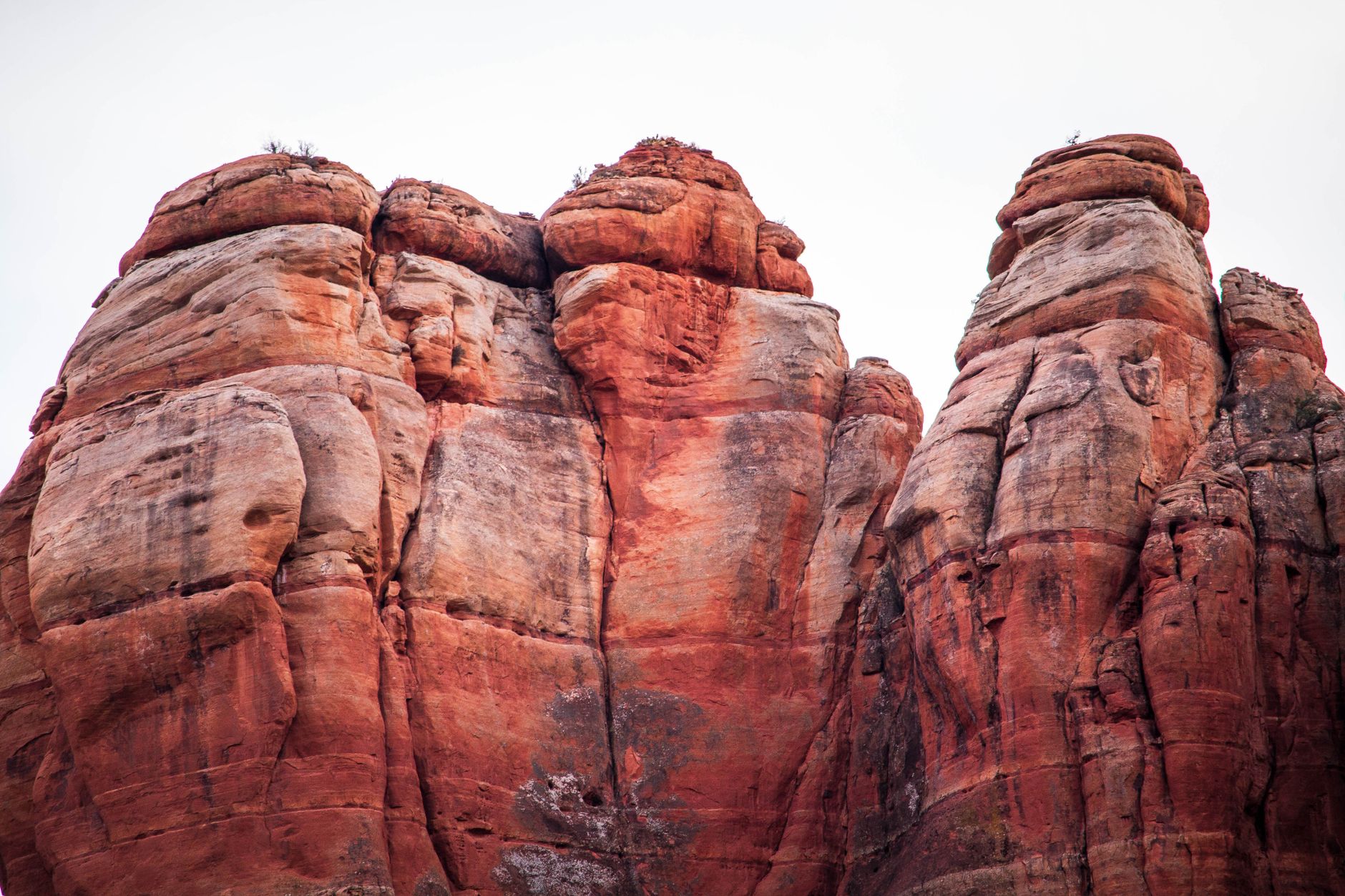 Tourists admiring Sedona McDonald‘s with blue arches against a desert sky