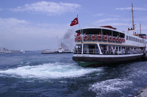 Free stock photo of ferry, flag, sea Stock Photo
