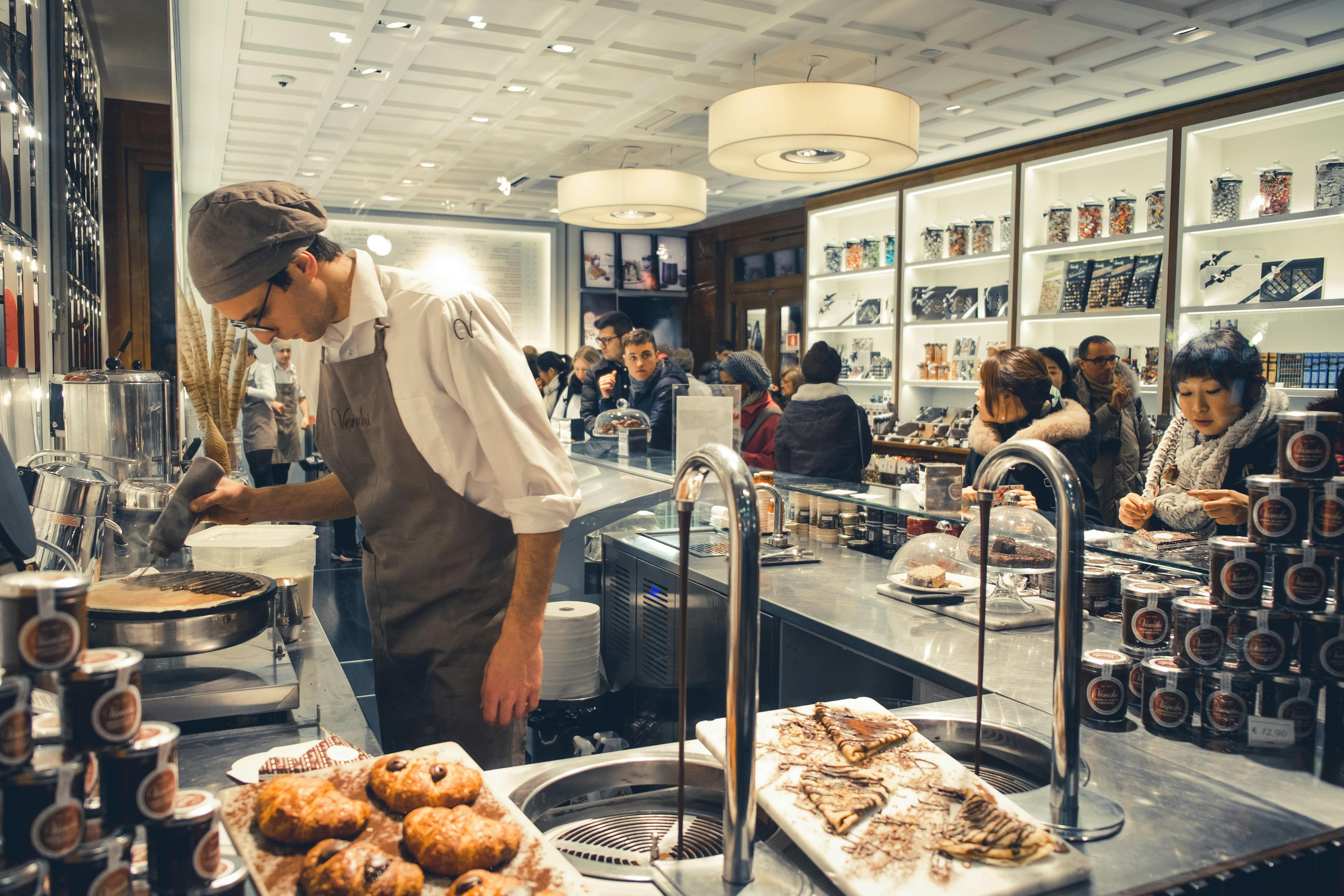 man in an apron working in a bakery