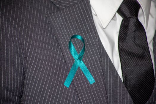 A Ribbon Pin on a Suit Lapel