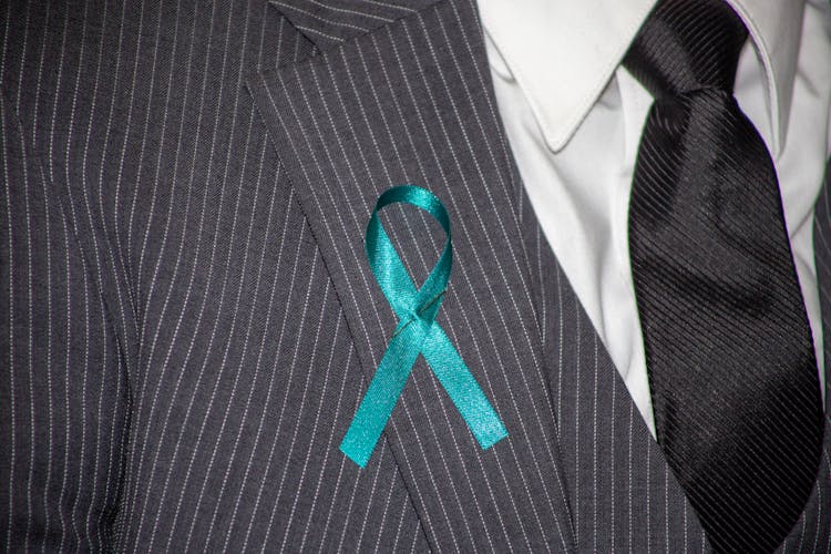 A Ribbon Pin On A Suit Lapel