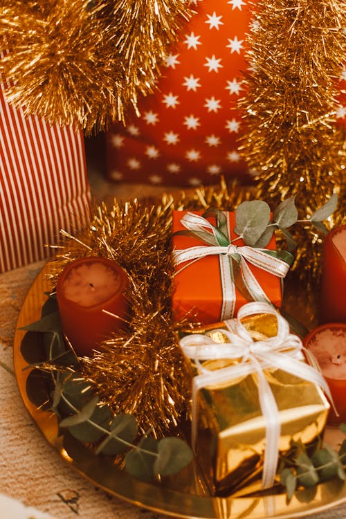 A Gift Boxes Surrounded with Gold Tinsel