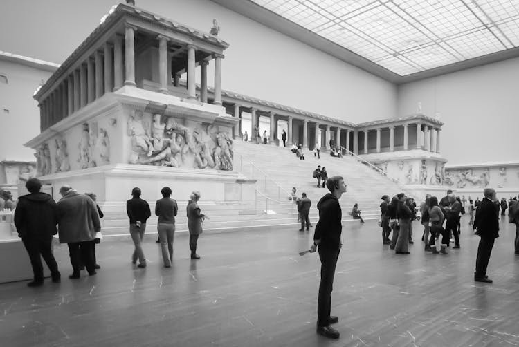 People On Excursion In Museum