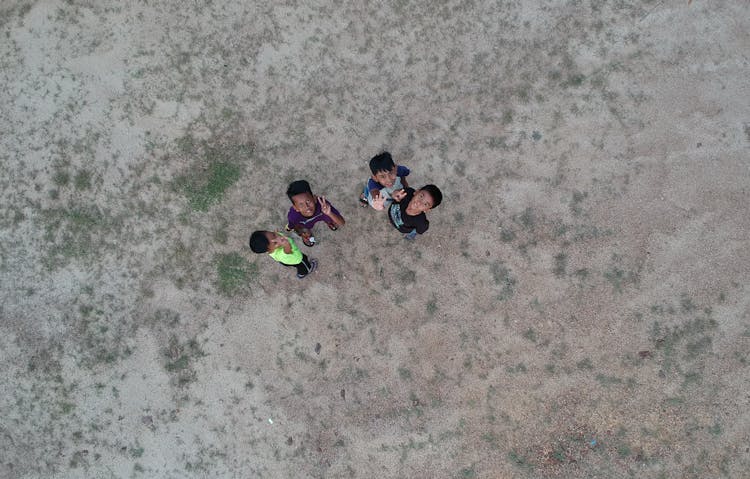 Kids Waving To Sky