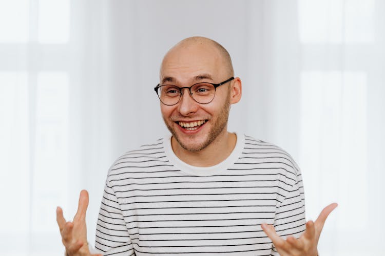 Man In White And Black Striped Shirt Smiling