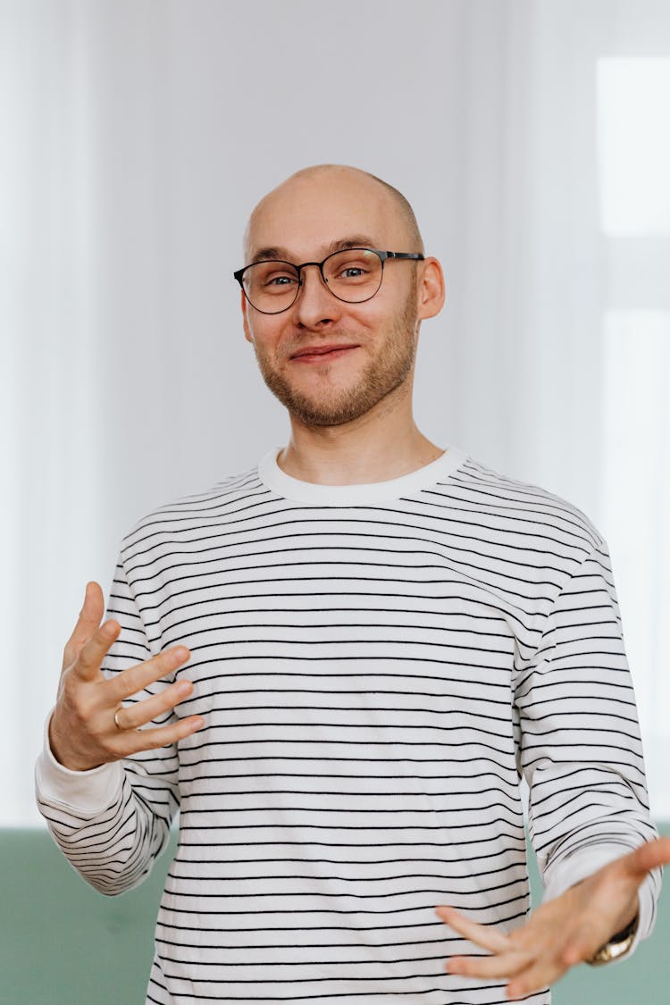 Man In White And Black Striped Shirt With Black Framed Eyeglasses