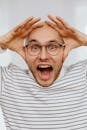 Man with Hands on Head Yelling