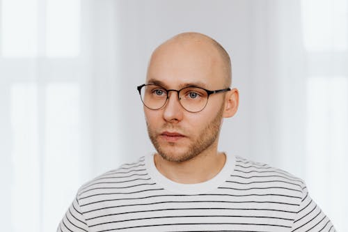 Man Wearing Striped Shirt and Eyeglasses