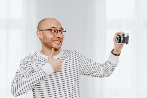 Free Man Posing with His Thumbs Up Stock Photo
