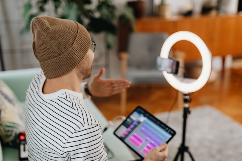A creator filming a video at home with a ring light — photo by kaboompics.com on Pexels