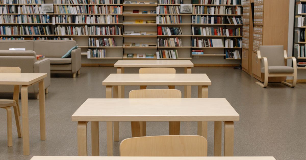 Wooden Tables Inside the Library · Free Stock Photo