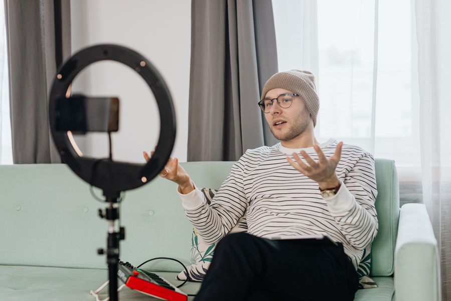 Creator filming with a ring light by kaboompics.com on Pexels