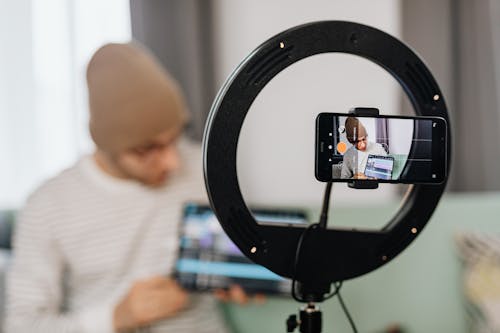 Shallow Focus Photo of a Man Making a Vlog