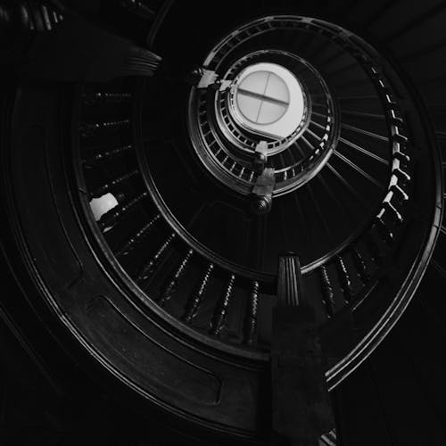 Grayscale Photo of a Spiral Staircase