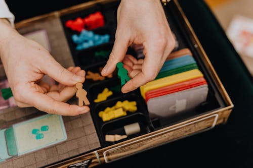 Close Up of Men Hands Playing With Board Game