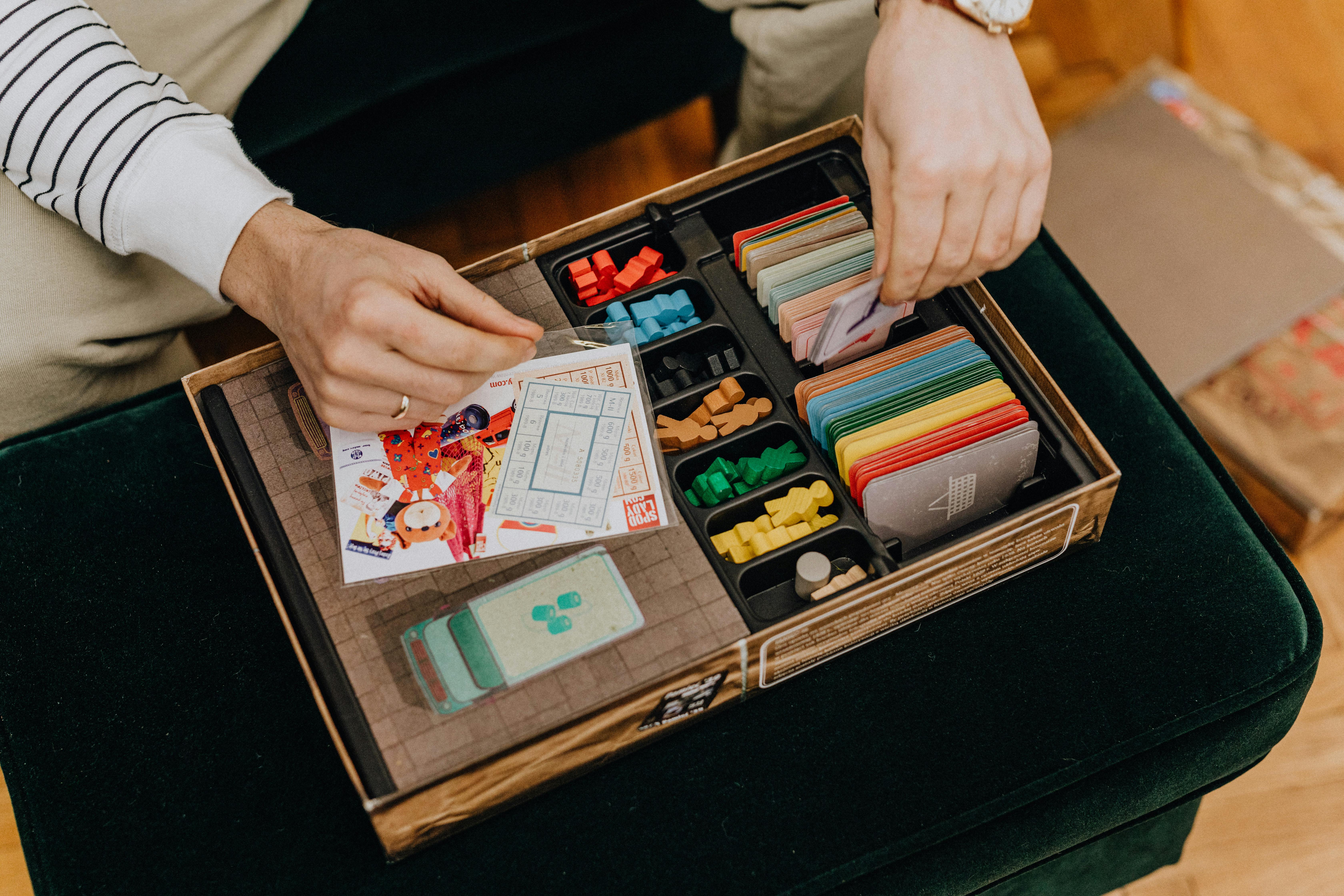 close up of men hands playing with board game