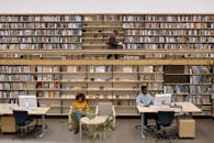 Woman in Yellow Sweater Sitting on Chair