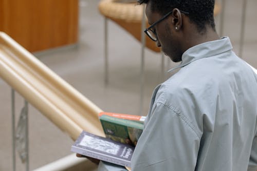 Photo Of Man Reading A Book