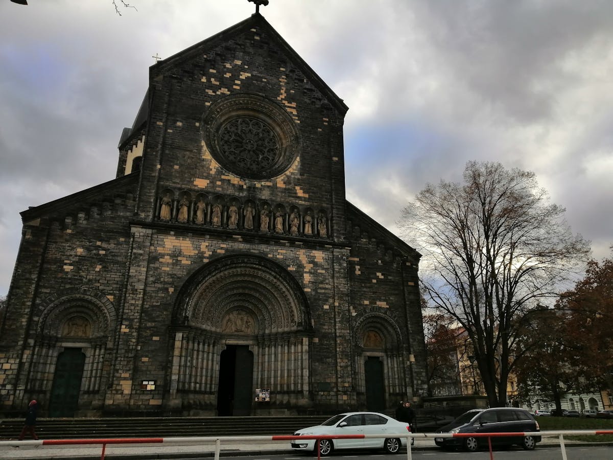 Person taking notes while watching content on a laptop