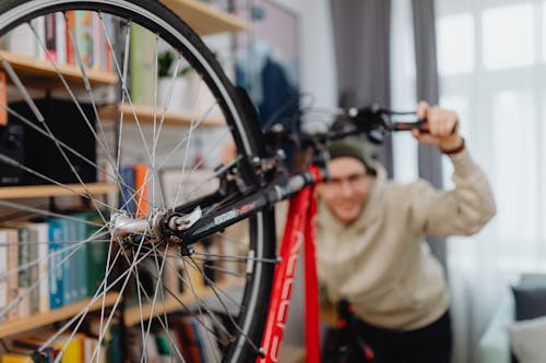 Man with Bike in Apartment