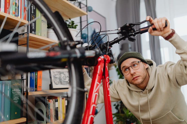 Man Repairing Bike At Home