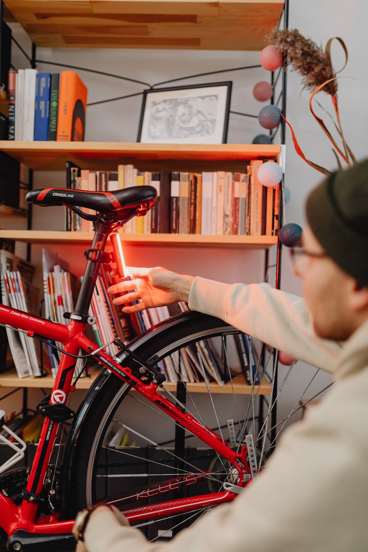 Man With Bike In Home Interior