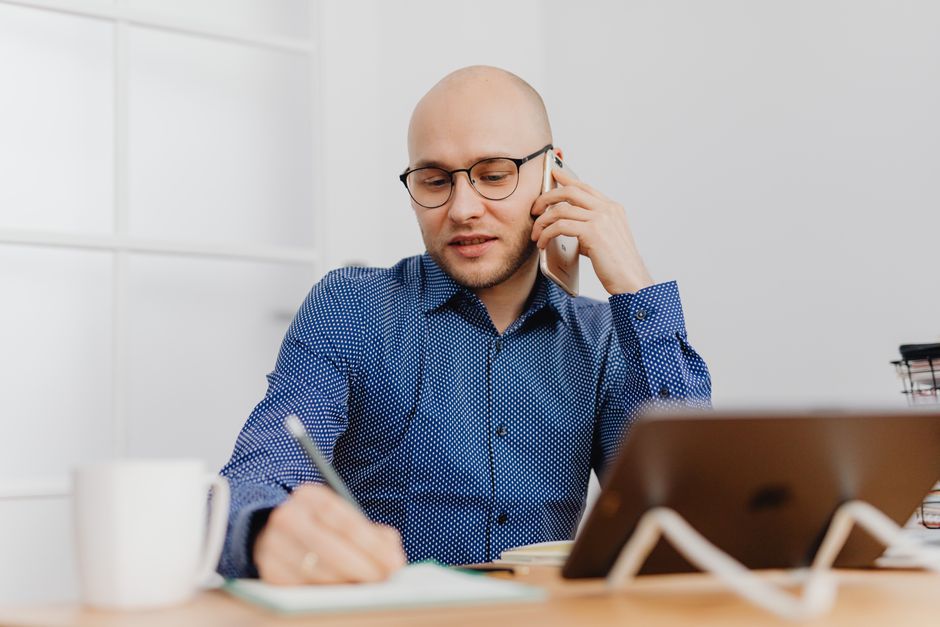 businessman phone call notes desk