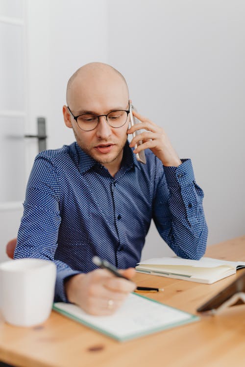 Man Talking on Phone in Office