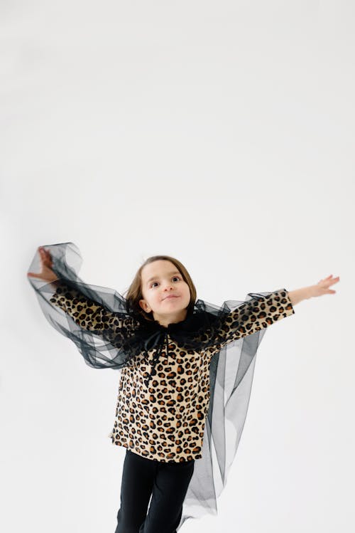 Little Girl in Leopard Print Shirt Dancing