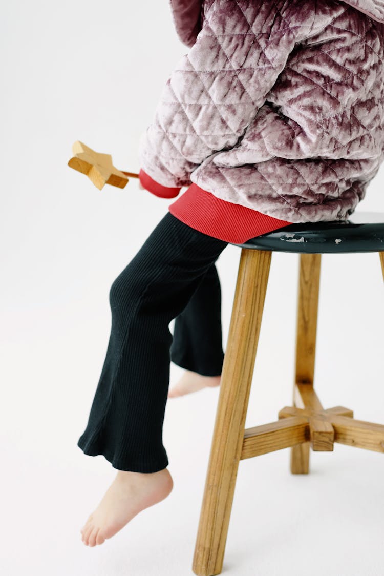 Kid Sitting On Stool