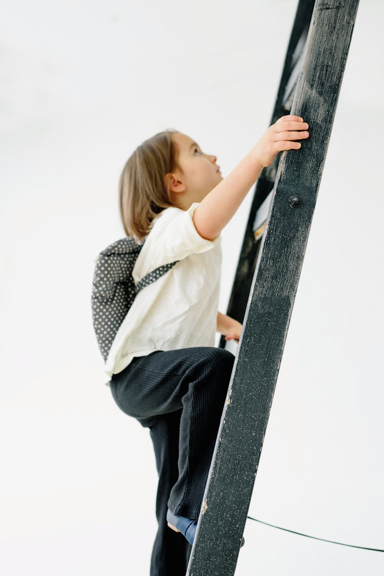  Toddler Climbing A Wooden Ladder