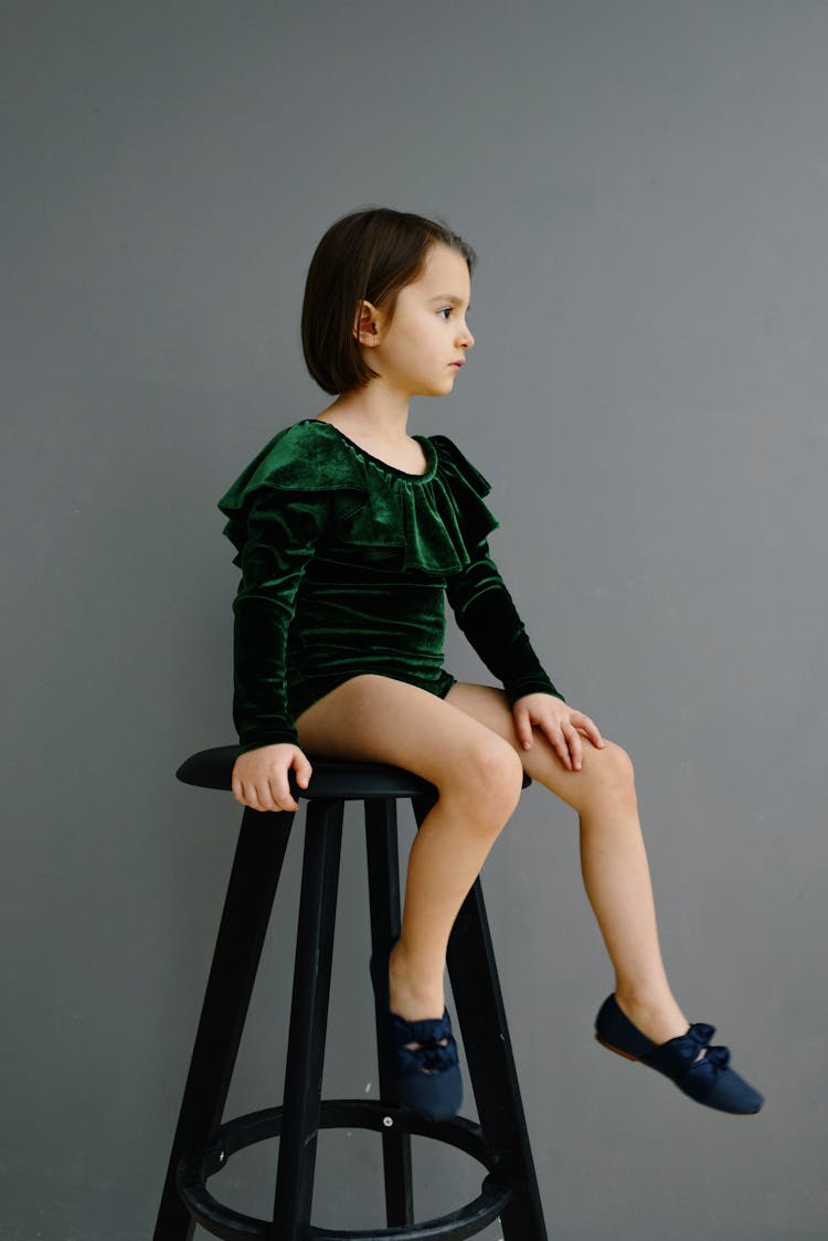 Girl Sitting On A Stool