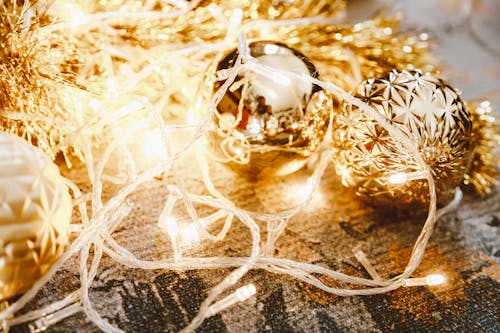 String Lights over Gold Bauble and Garland