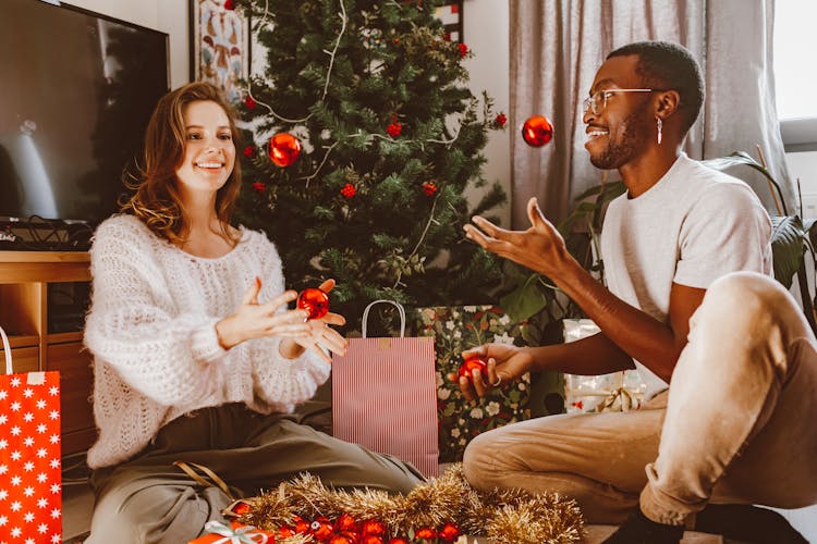 Couple Decorating Christmas Tree Together