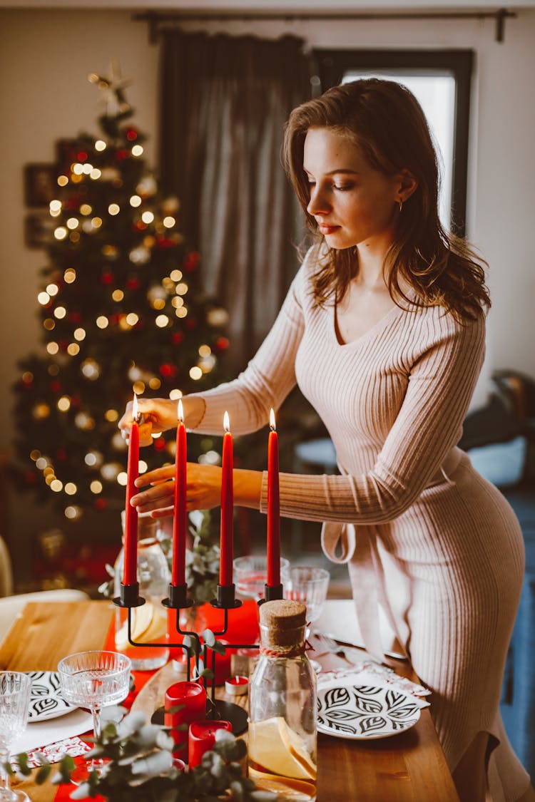 Woman Lighting Wax Candles