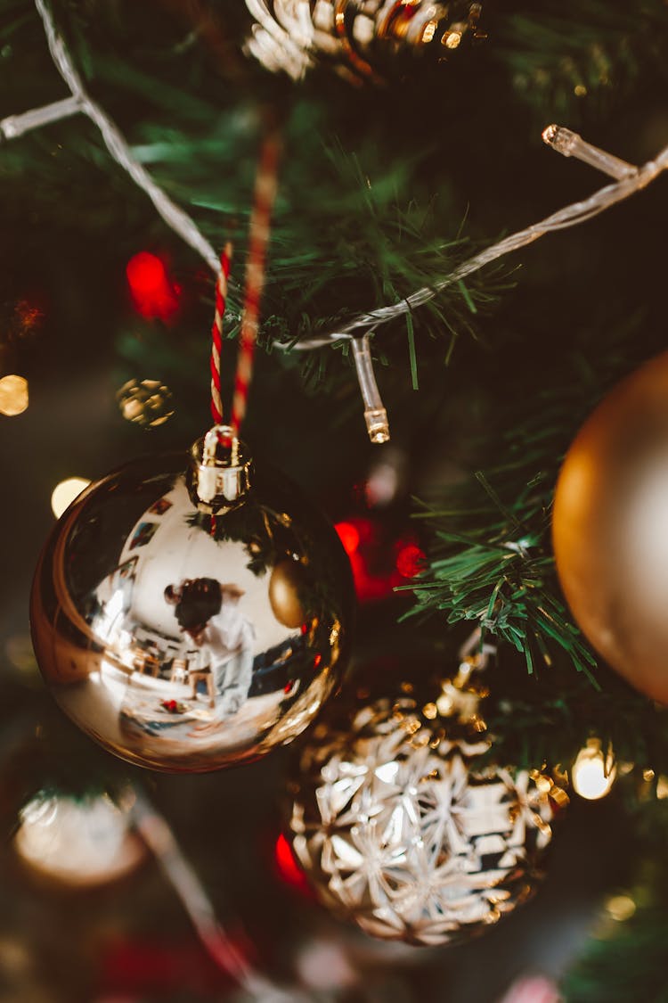 Gold Christmas Balls Hanging On A Tree