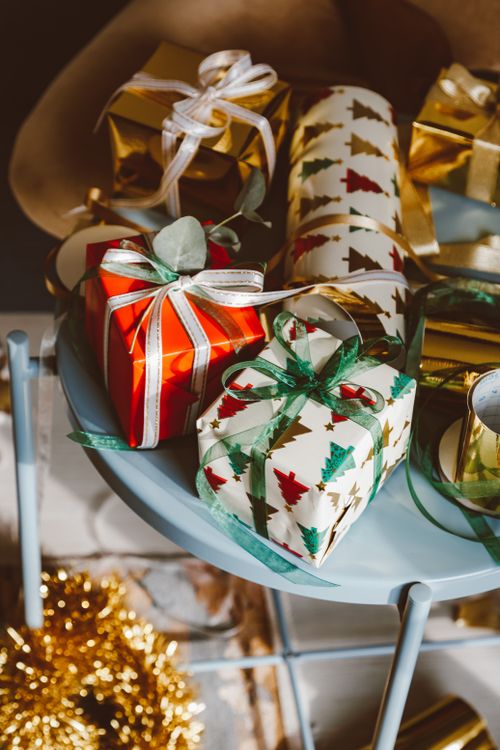 Free Elegant Christmas gifts wrapped with themed paper, perfect for the holiday season. Stock Photo