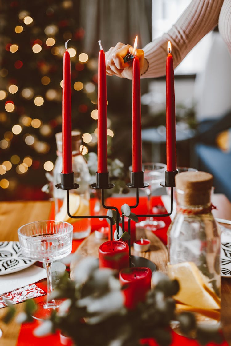 Lighting Wax Candles On Table