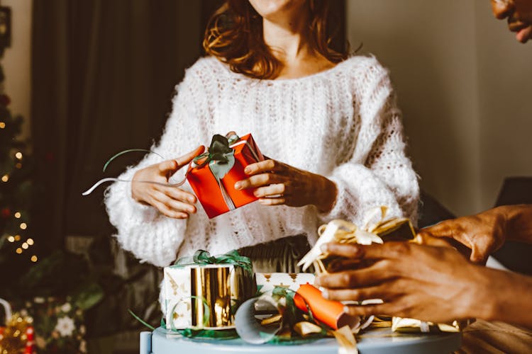 Woman Holding A Christmas Present