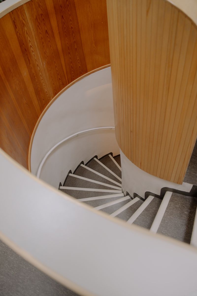 Spiral staircase on wooden flooring