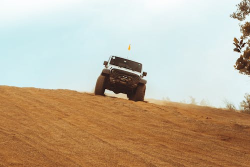 Free White Sport Utility Vehicle on Dirt Road Stock Photo
