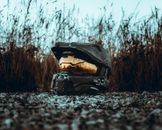 Gray Helmet on a Rocky Ground