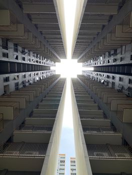 A striking view of skyscrapers from below in Singapore, highlighting modern architecture.