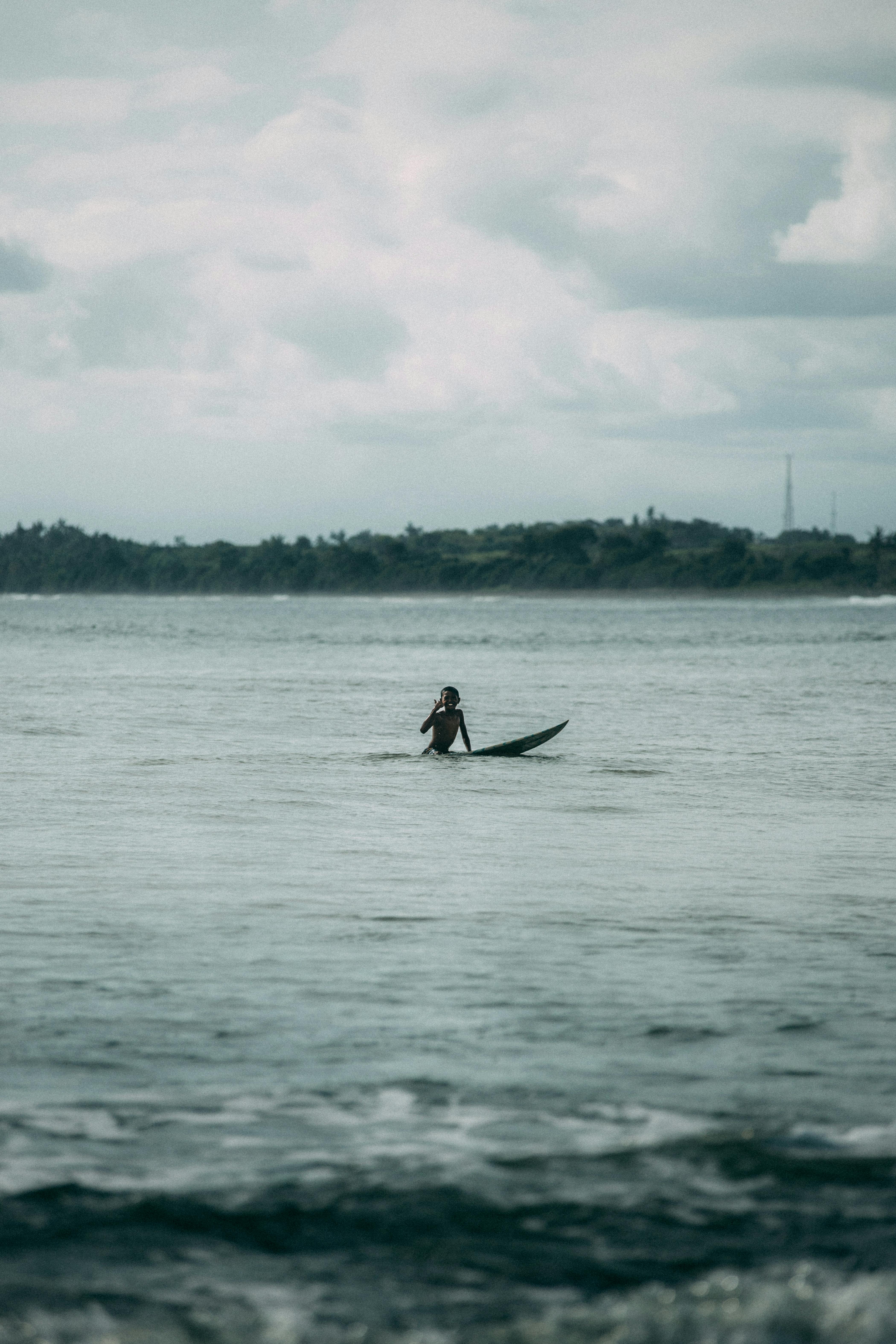 person surfing on the sea