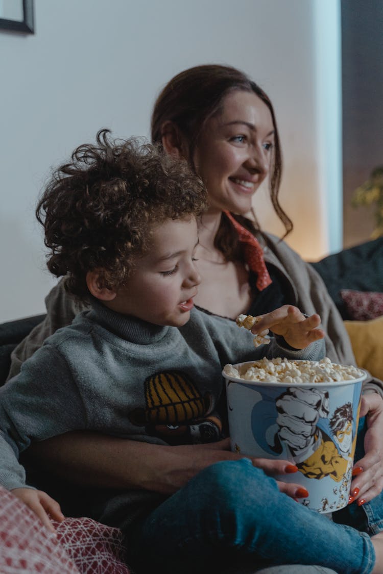 Mother And Son Eating Popcorn